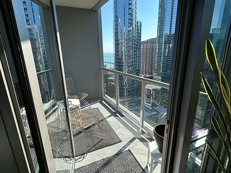 Balcony off the living area with a south, east and east view! See the lake, riverwalk, Wabash, Michigan ave, the river and more!