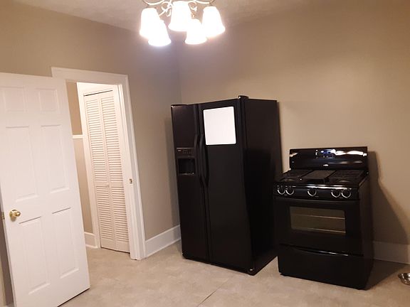 gas stove with warming bin on bottom/utility closet in half bath (catbox area)
