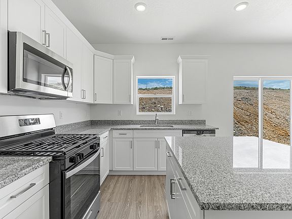 This kitchen is chef-ready with stainless-steel appliances