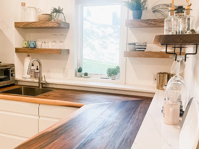 The clean, modern kitchen has everything you need for extravagant meals, or quick snacks to go. This space has been put together by selecting materials and items that don't give off harmful substances as byproducts.