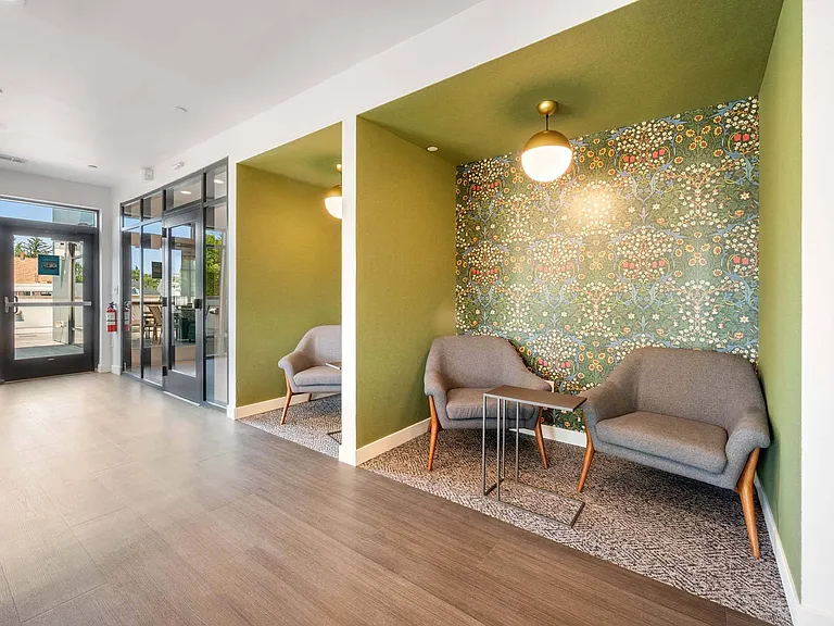 Settle into the seating booths surrounded by windows and natural light, perfect for work, conversation, or a quiet break.