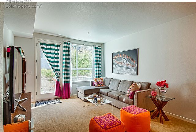Spacious living room facing courtyard