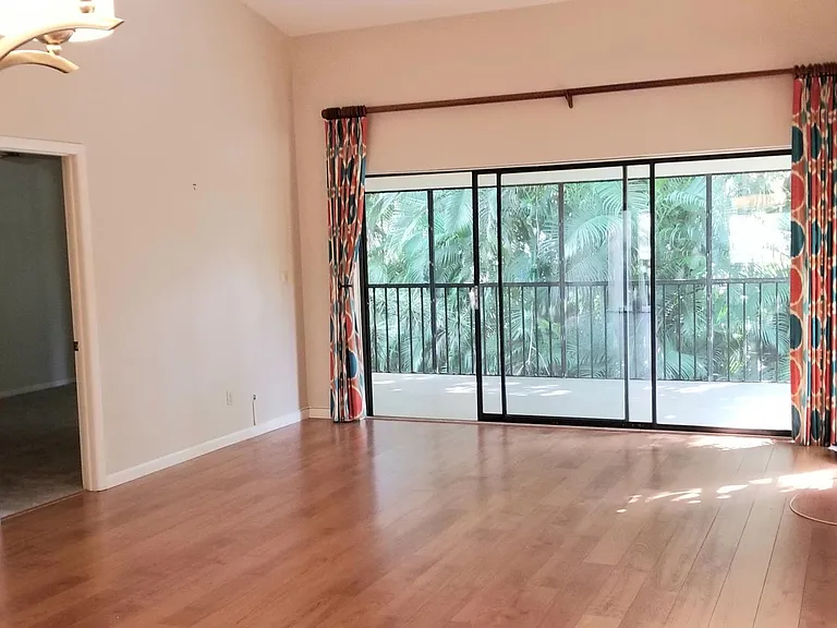 Living room and dining room area with views