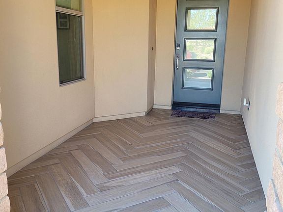Beautiful tile continues into the residence and back patio