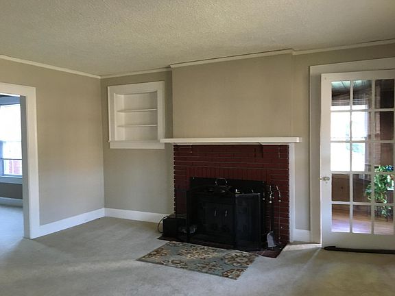 Working fireplace insert in living room.