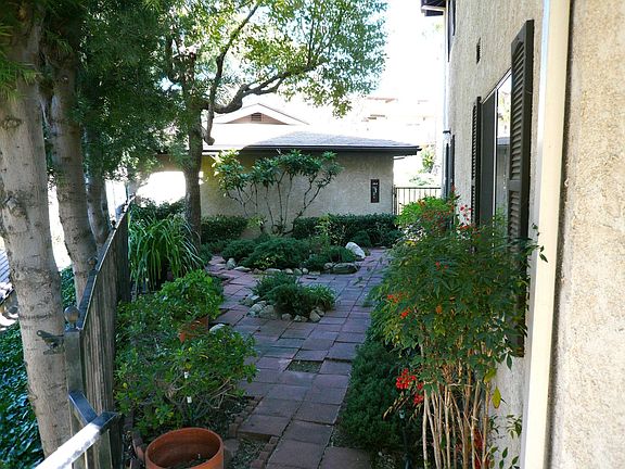 Yard with 2 Car private Garage in Background