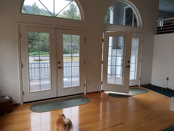 Double french doors leading to covered deck