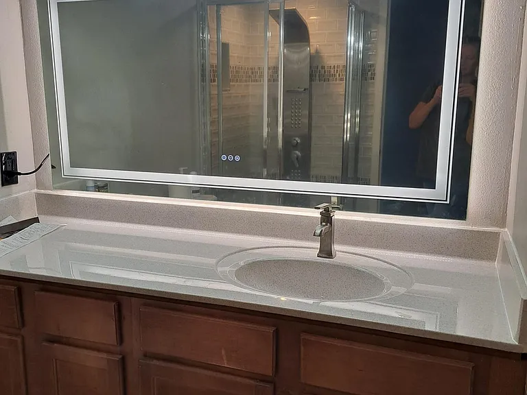 On-suite bathroom with adjustable light mirror and defogger.