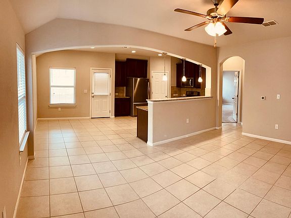 Beautiful arch with open living and dining concept.