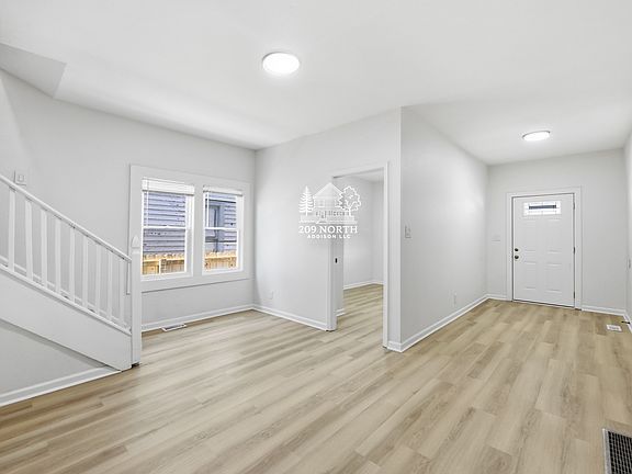 Main entrance, living/dining room, and bedroom 1