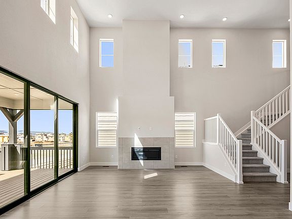 Great room with fireplace and 3-panel multi-slide door