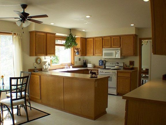 Comfortable, warm invitng style in the kitchen that has lots of counter space for the chef to create