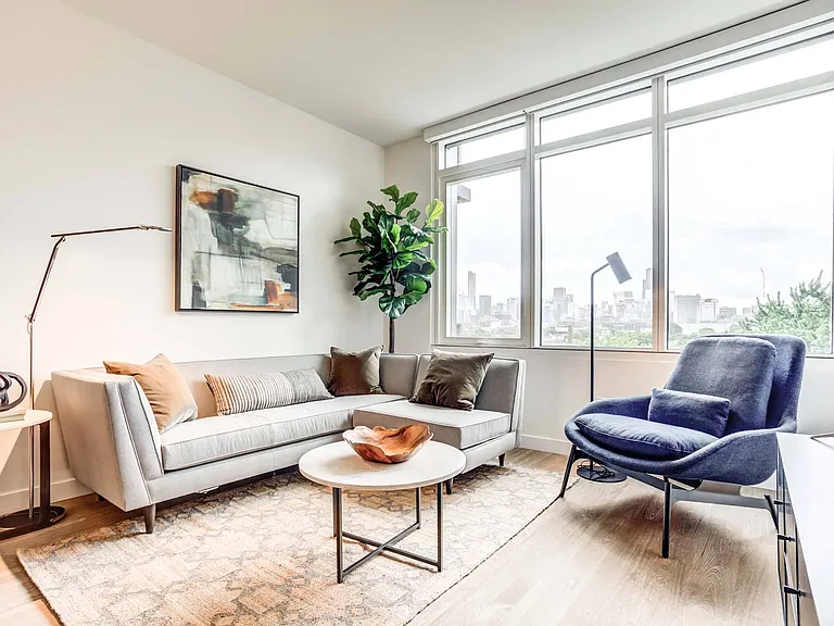 Natural light floods into your spacious living room, offering a warm and inviting atmosphere.