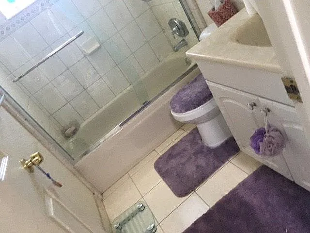 Hallway bathroom with a tub