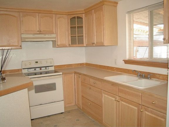 All new kitchen including light Maple cabinets, counter tops and flooring.