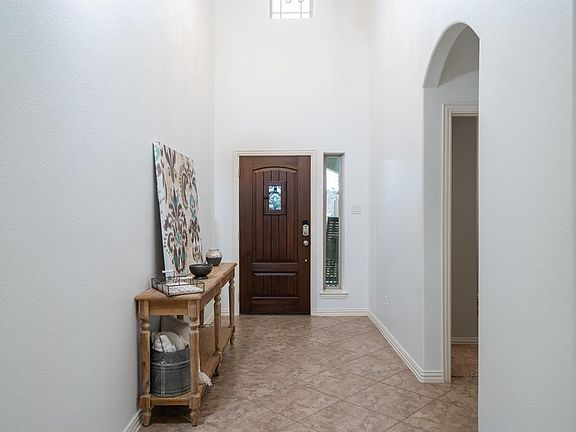 A pocket window above and sidelight window next to the door lets the light shine through onto the freshly painted interior. Just to the right, this home offers a secondary bathroom and full bath, making it ideal for a guest retreat or in-law suite!