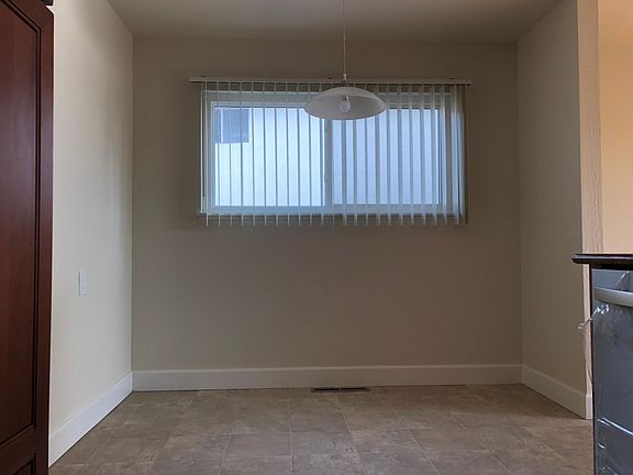 Breakfast nook off kitchen. Door to left is to garage.