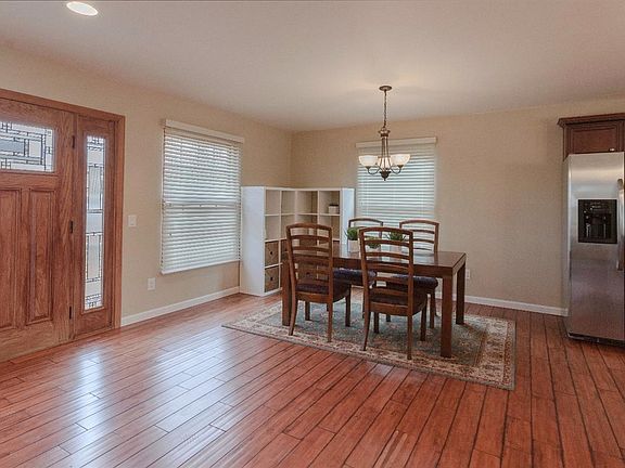 The dining area is filled with lovely natural light and is perfect for various dining room table shapes and sizes...just move yours set in and the space will be complete!