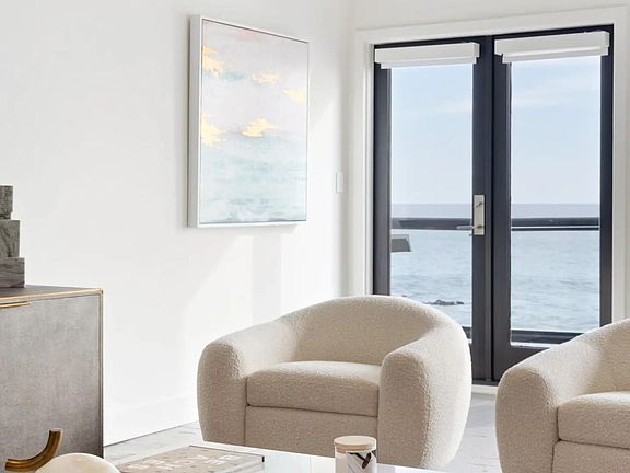 Well furnished living room with ocean view balcony