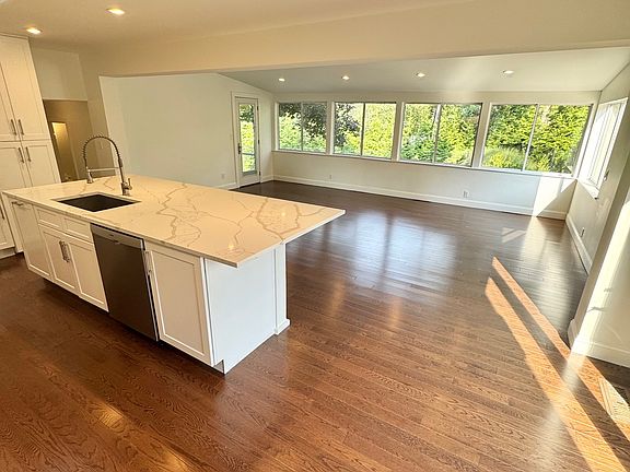Updated kitchen with quartz countertops with open floor plan