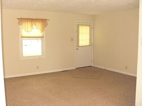 LIVING ROOM W/NEW CARPET