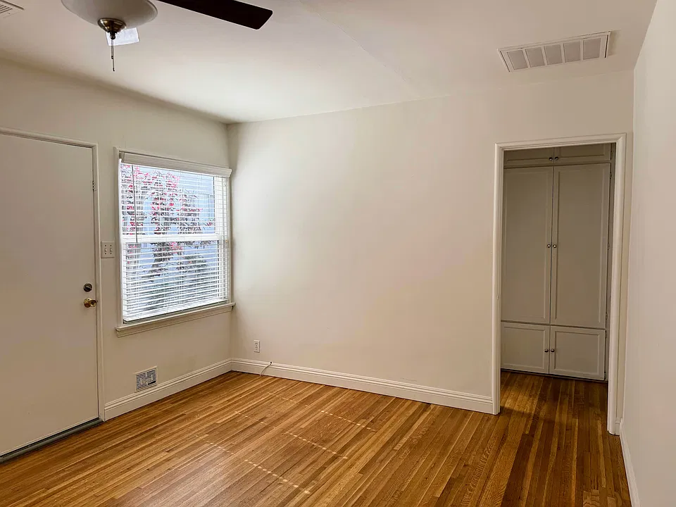Side space in living room perfect for a desk, reading area, etc.