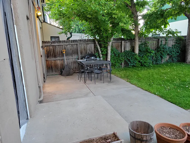 Large patio with 4 chairs and table included