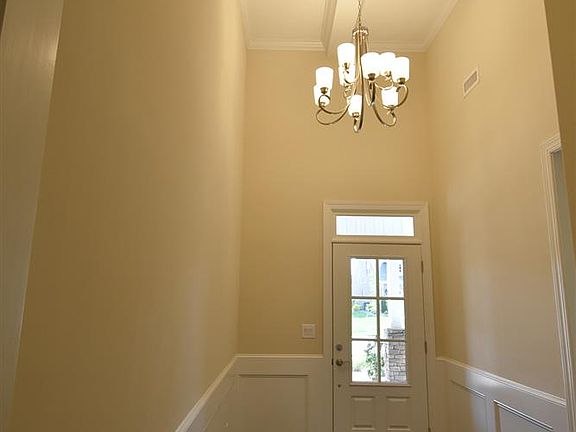 Two-story foyer with coffered ceiling
