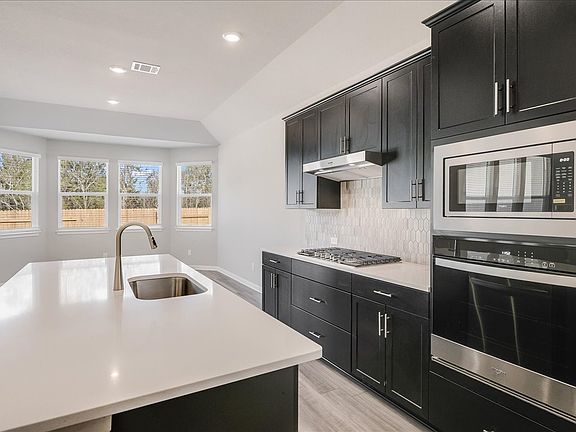 Cook your favorite meal in the beautiful kitchen with lots of natural lighting.