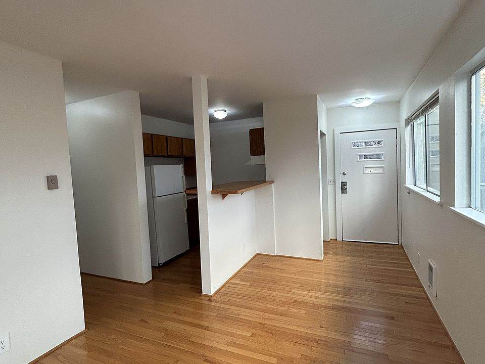 Living Room View of Entry and Kitchen