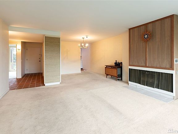 Wide, bright and light. Gas fireplace with custom surround.