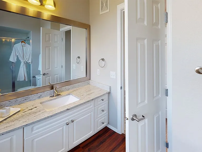 Bright bathrooms with granite counters and upgraded fixtures