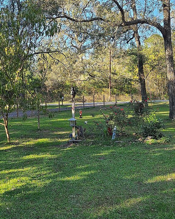 large fenced front yard