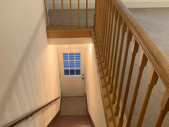 Private entrance with stairs leading into apartment