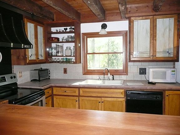 Kitchen Features Custom Stain Glass Cabinetry & Great Lighting