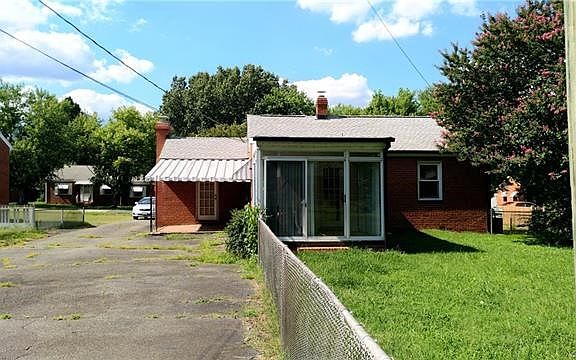 So much parking and outdoor space! Enjoy patio with canopy, florida room or fenced rear yard with mature trees.