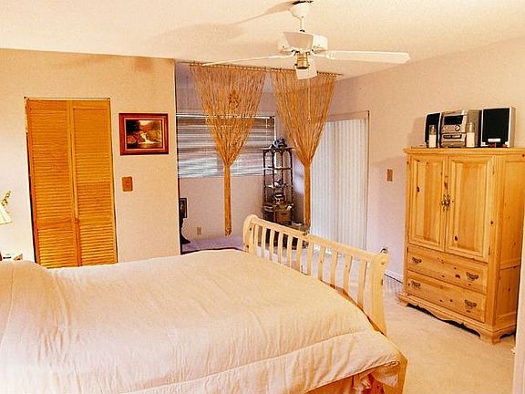 Lg Mstr bed w/walkin closet & sitting room.  Sliding doors lead to porch.