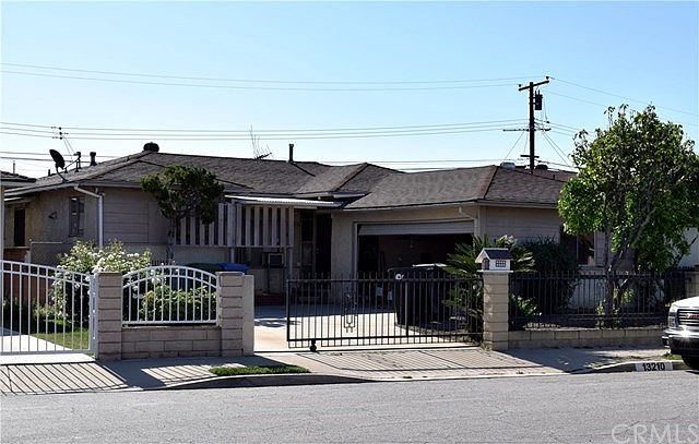 Fenced and gated front yard.