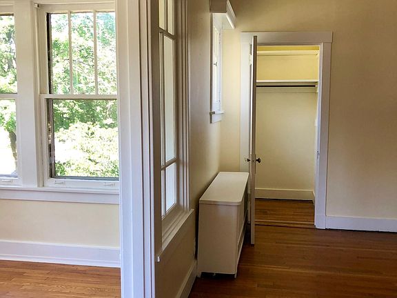 Sunroom, living room with a walk-in closet at the back of the living room