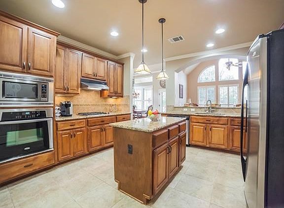 Gourmet kitchen with granite counters and endless cabinet space
