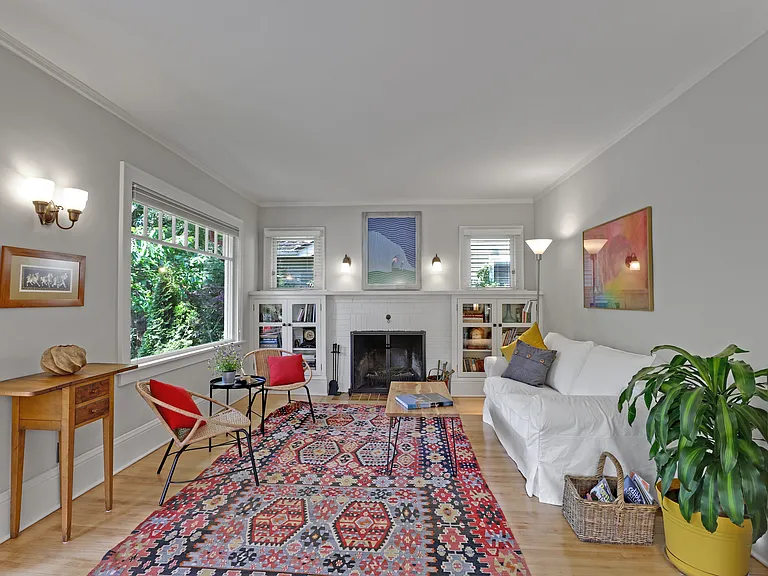 living room with wood burning fireplace