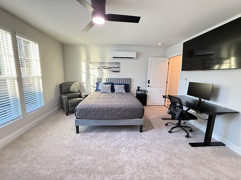 Flooded with natural light_your own private sanctuary above the garage.