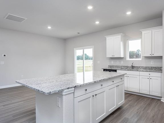 The living room opens to the kitchen