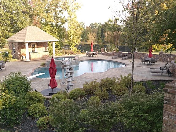 Patio
						:
						View from patio of pool, pool house, and pond.