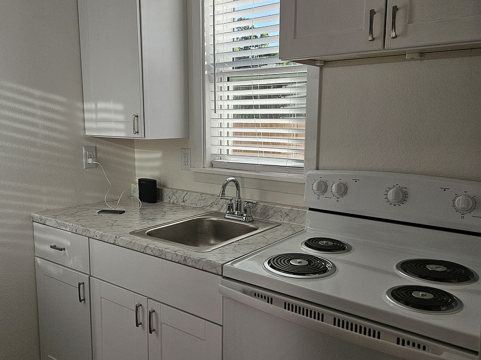 Kitchen new cabinets & electric oven.