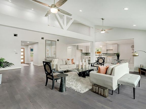 Talk about cool... nice ceiling fans, recessed lighting, custom colors makes this Meyerland home a treasure