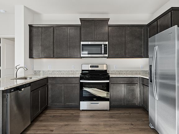 The kitchen has energy-efficient, stainless-steel appliances.