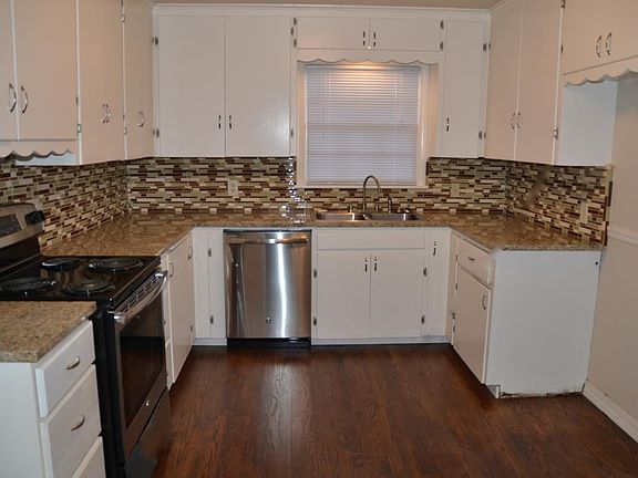 Kitchen - stainless range & dishwasher, as well as microwave