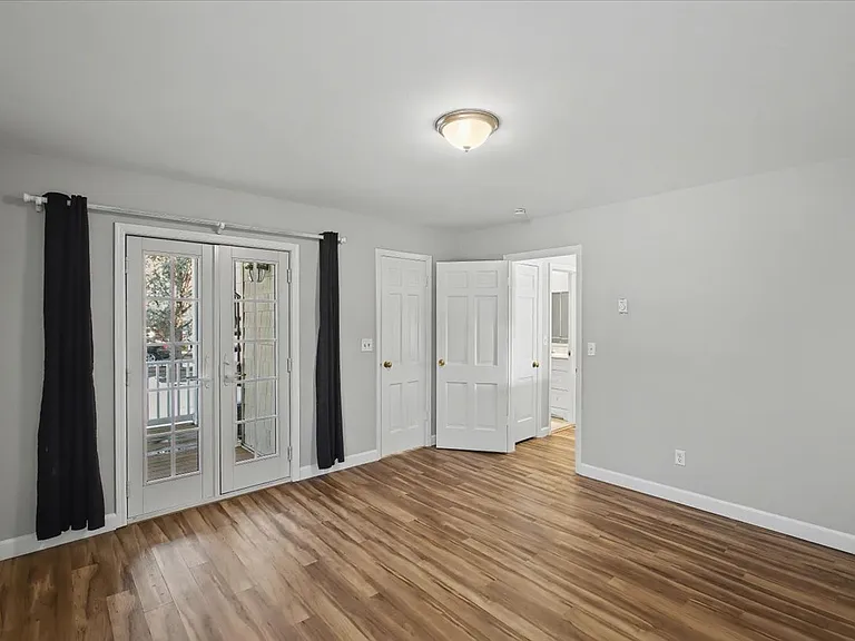 Bedroom having doors out to porch