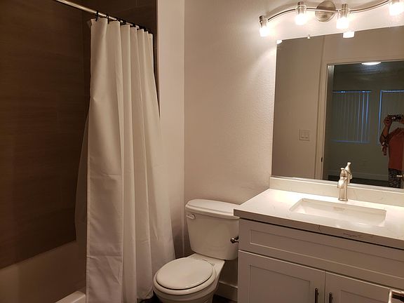 MASTER BATHROOM WITH GRANITE COUNTER TOPS, TILE SHOWER AND TUB